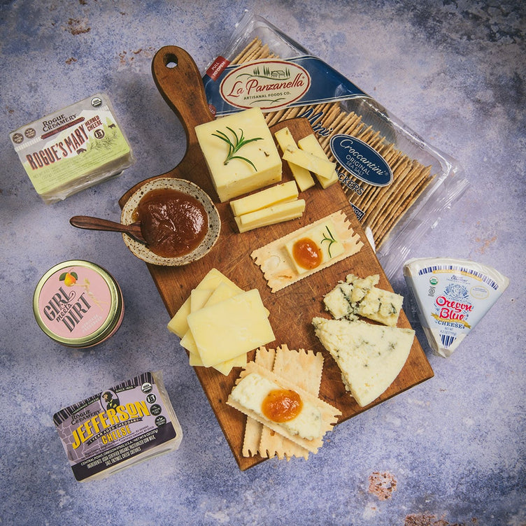 Organic cheese with crackers and jams on wooden cutting boards