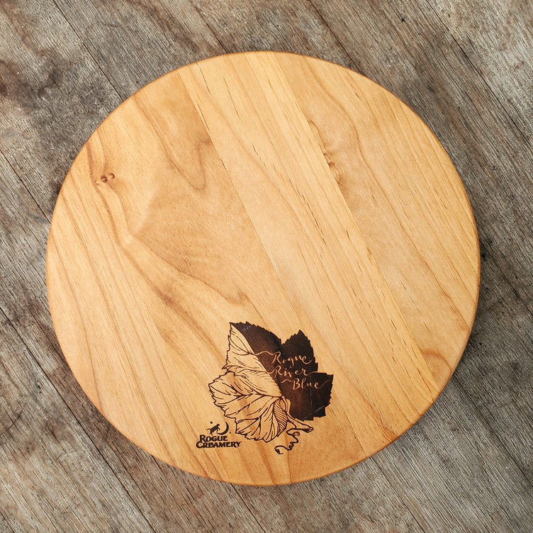 Wooden cutting board with Syrah grape leaf burned onto surface