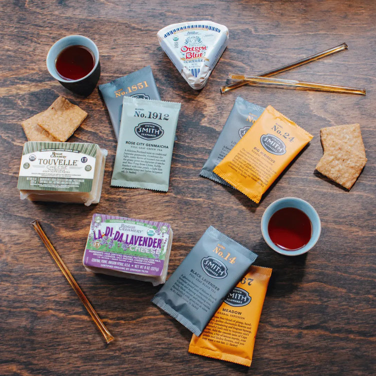 Organic cheese on wooden background with tea packets and honey sticks