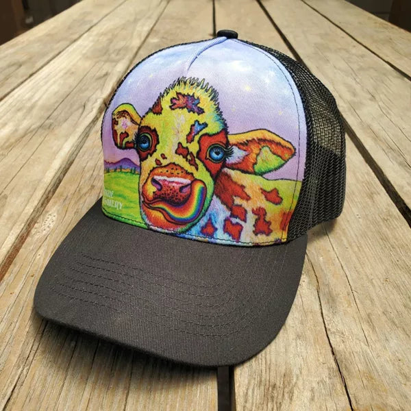 Alternative view of Rainbow Cow hat on wooden background