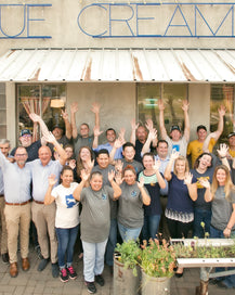 Rogue Creamery team celebrating in front of the Cheese Shop