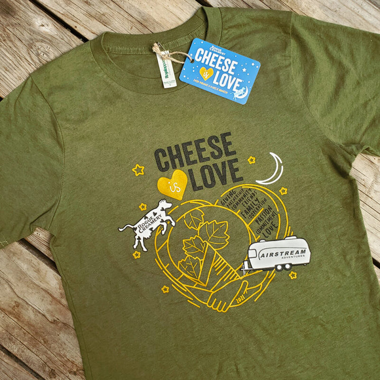 Cheese is love shirt with a cow jumping over a heart on wooden background