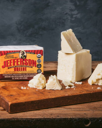 Crumbled aged cheddar on cutting board with Jefferson 2 Year label