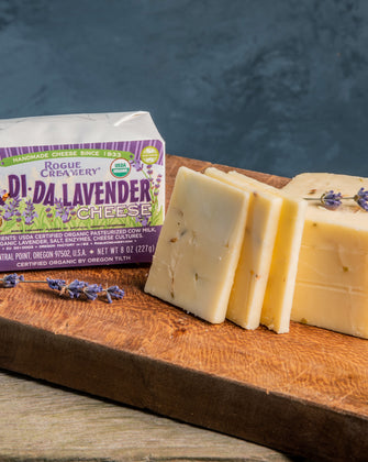 Organic Lavender Cheese on cutting board with leaves of lavendar