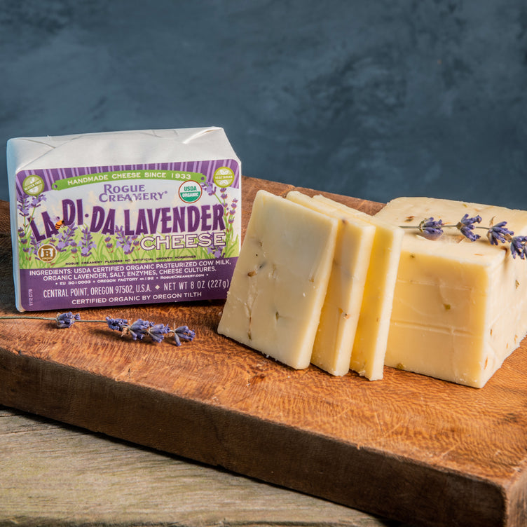 Organic Lavender Cheese on cutting board with leaves of lavendar