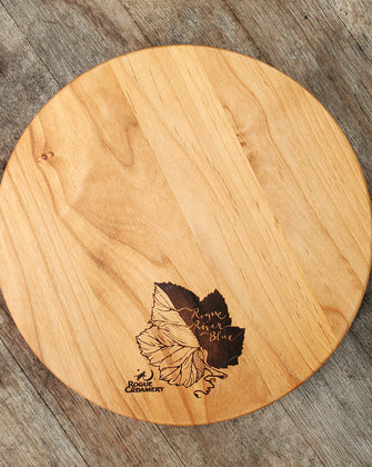 Wooden cutting board with Syrah grape leaf burned onto surface