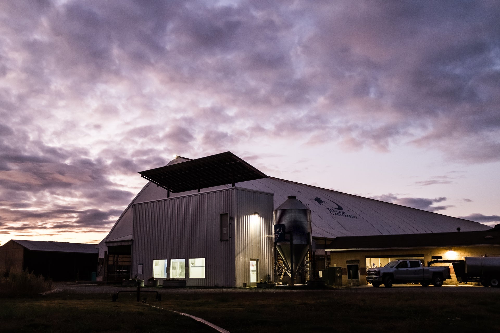 Rogue Creamery organic dairy farm at dusk with lights