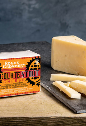 Chocolate Stout cheese on stone cutting board