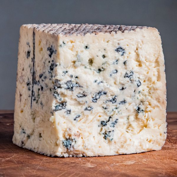 Rogue Creamery Organic Caveman Blue Wedge close up of cheese caves