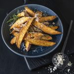 Rogue Creamery Blue Heaven Blue Cheese Powder over potato wedges with Rosemary