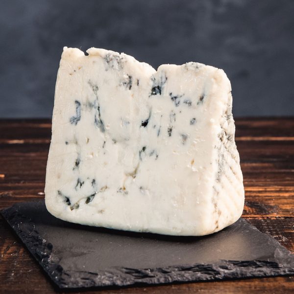 Rogue Creamery Crater Lake Blue Cheese Wedge on wooden background
