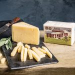 Rogues Mary Cheddar slices on cutting boards