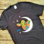 Colorful Cow T-shirt on wood tabel