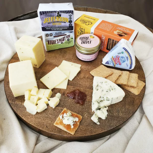 Jefferson 1 year cheddar, Rogue's Mary Cheddar, Oregon Blue Cheese, Effie's Oatcakes, and Girl Meets Dirt Pink Bartlett spread on a cheese board