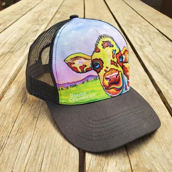 Rogue Creamery Colorful Cow Hat on wooden tabel