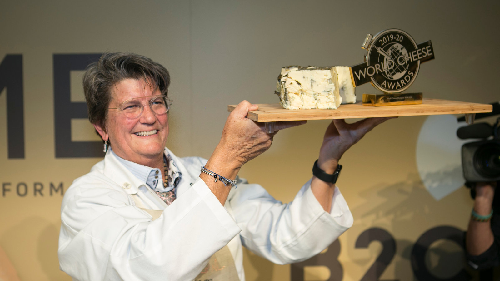 Woman holding Rogue Creamery's World Famous Rogue River Blue at the World Cheese Awards in 2019/2020